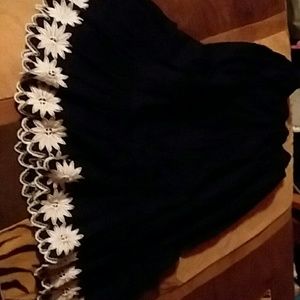 A black skirt with some white at the bottom.